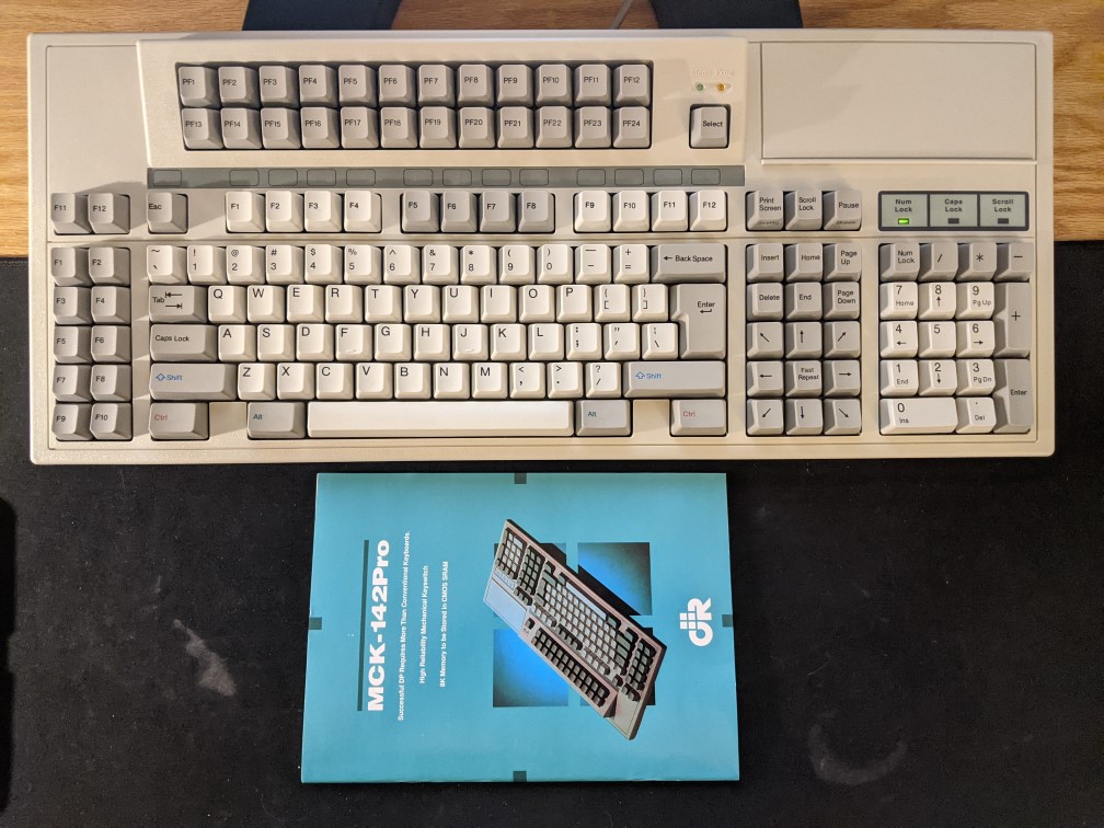 The MCK142Pro Keyboard and Manual, sitting on a desk.